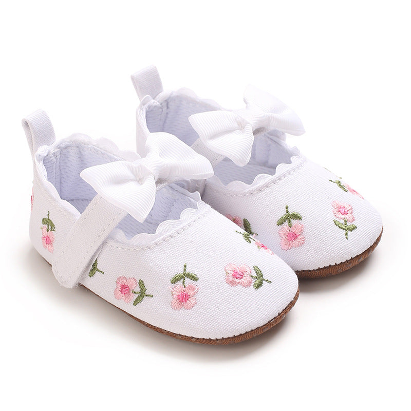 Children's Shoes with Little Flowers and a Small Bow