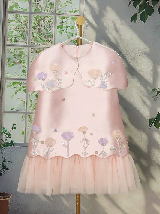 Floral dress for girls with tulle trim.