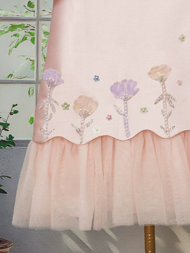 Floral dress for girls with tulle trim.