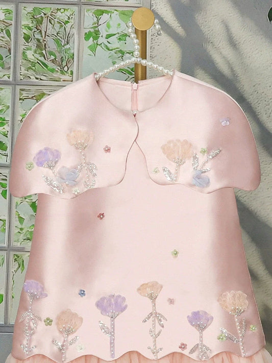 Floral dress for girls with tulle trim.